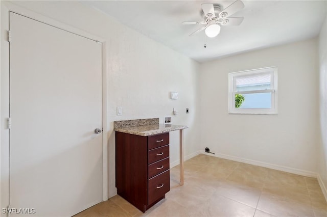 laundry area with baseboards, ceiling fan, laundry area, hookup for a washing machine, and hookup for an electric dryer