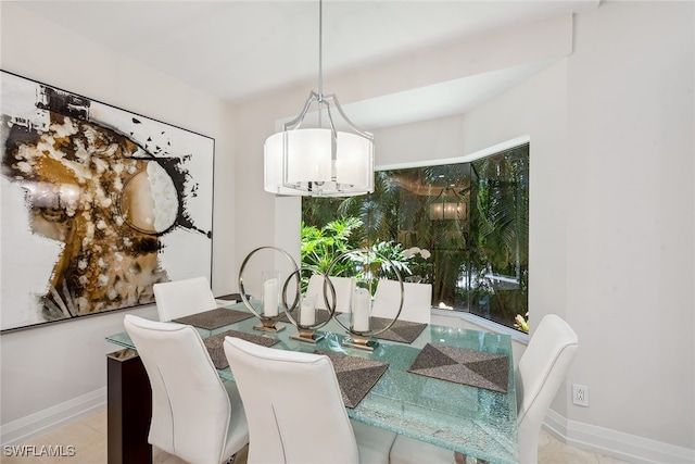 dining area featuring a notable chandelier and light tile patterned floors