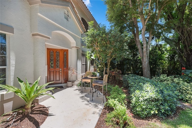 doorway to property with a patio