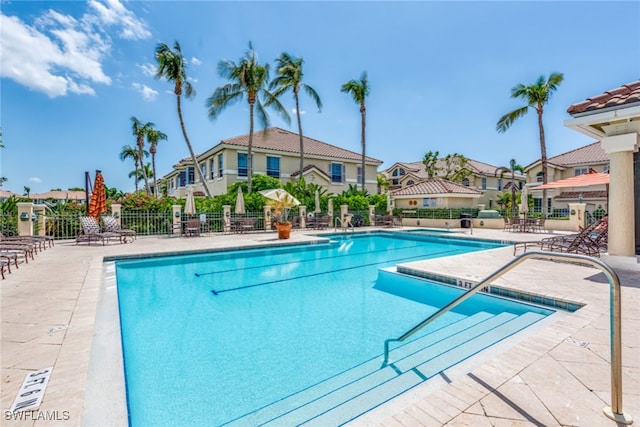 view of swimming pool with a patio