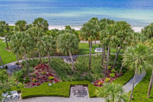 drone / aerial view featuring a view of the beach and a water view