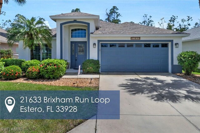 view of front of property with a garage