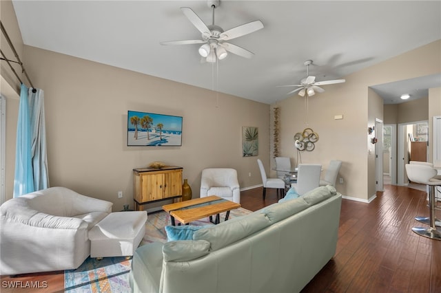 living room featuring dark wood-type flooring and ceiling fan