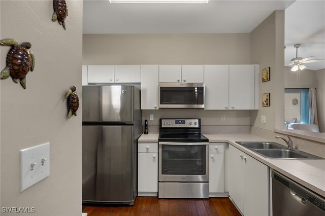 kitchen featuring white cabinets, stainless steel appliances, sink, dark hardwood / wood-style floors, and ceiling fan