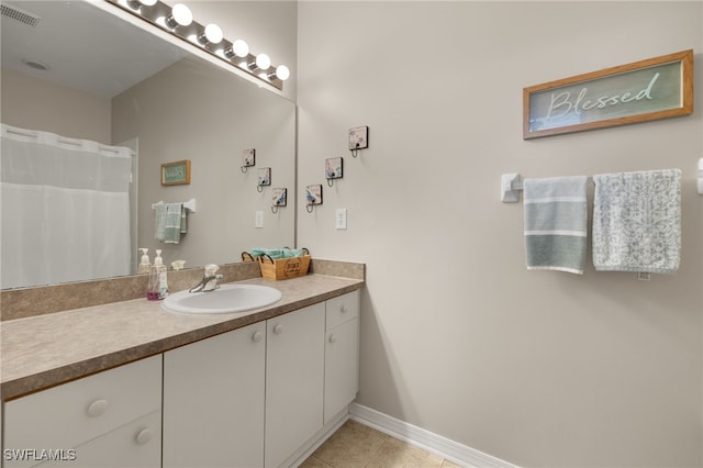 bathroom with tile patterned floors, vanity, and a shower with shower curtain