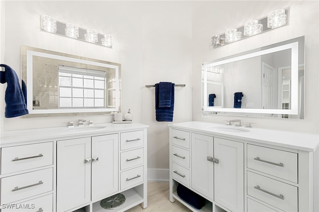 bathroom with vanity and hardwood / wood-style floors