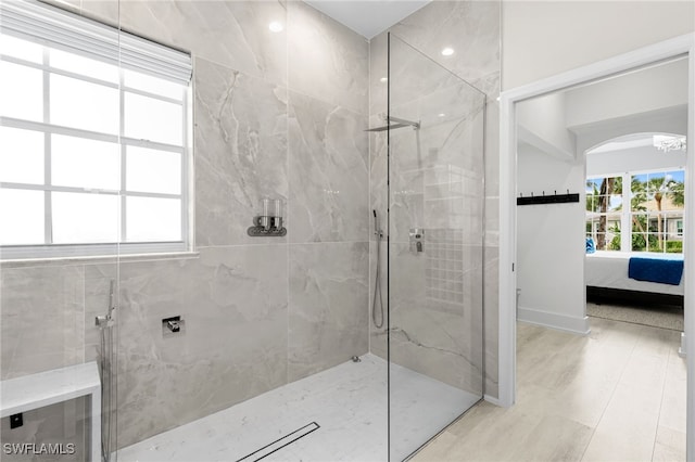 bathroom featuring a tile shower