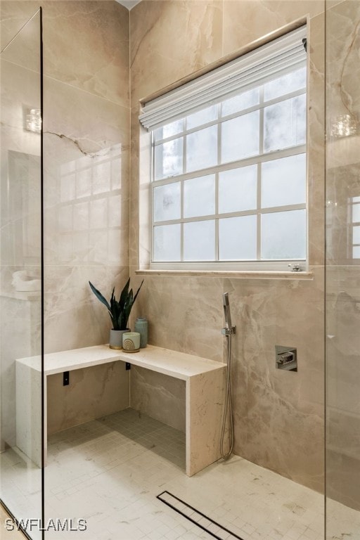 bathroom featuring tiled shower