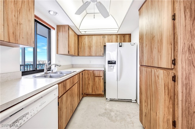 kitchen with white appliances, sink, and ceiling fan