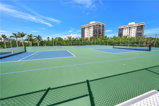 view of tennis court featuring basketball court