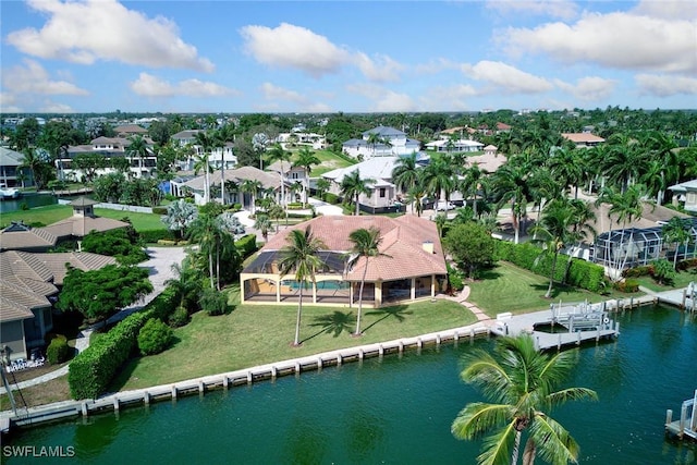 aerial view with a residential view and a water view