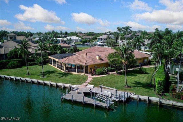 bird's eye view with a residential view and a water view