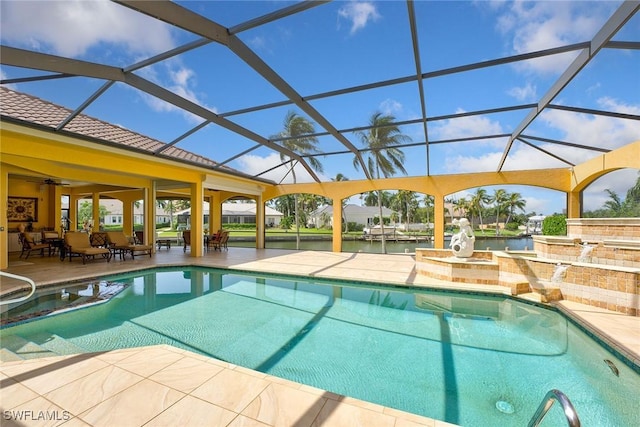 pool with a lanai, a patio, and a water view