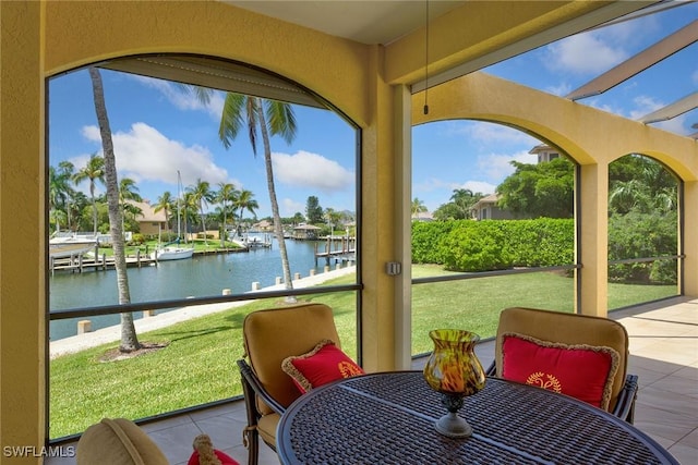 sunroom with a water view