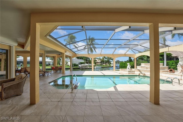 pool with a lanai and a patio area