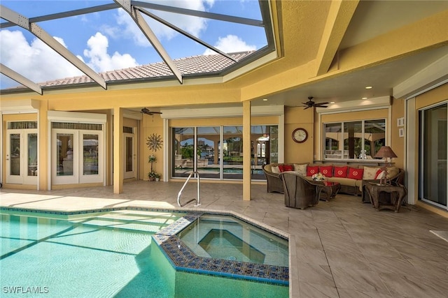 view of swimming pool with a patio area, an outdoor living space, a pool with connected hot tub, and a ceiling fan