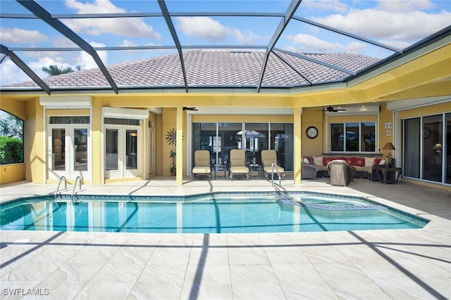 view of pool featuring a patio, a ceiling fan, a pool with connected hot tub, and an outdoor hangout area