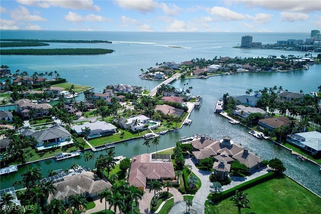 birds eye view of property featuring a residential view and a water view