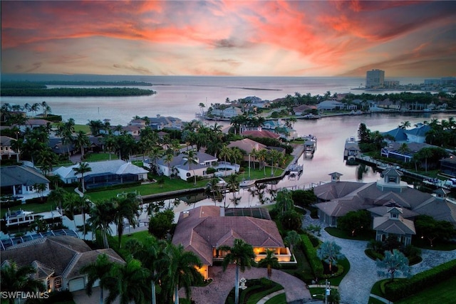 birds eye view of property featuring a water view