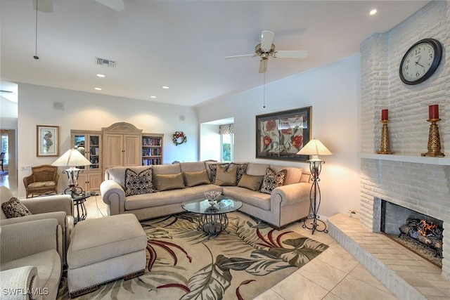 living room with visible vents, recessed lighting, ceiling fan, tile patterned floors, and a brick fireplace