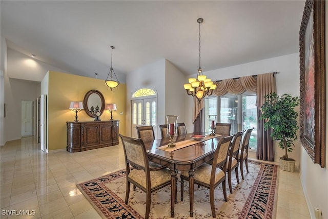 dining room with a wealth of natural light, french doors, a notable chandelier, and vaulted ceiling