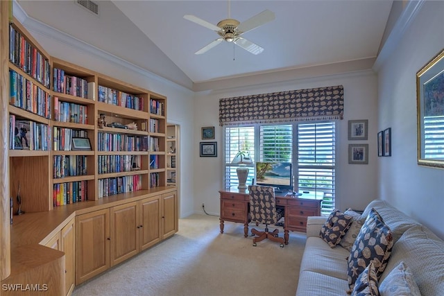 home office featuring lofted ceiling, visible vents, a wealth of natural light, and light carpet