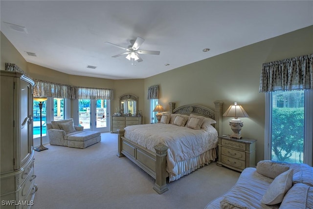 bedroom with ceiling fan, access to exterior, visible vents, and light carpet