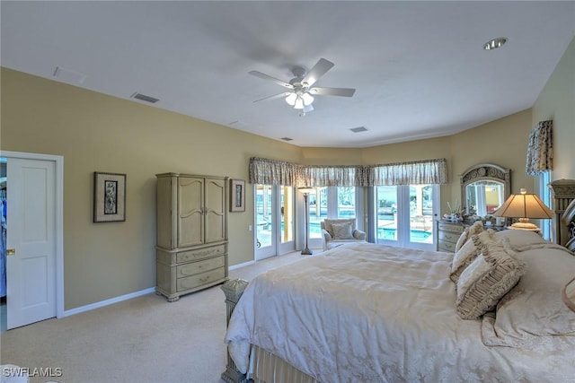 bedroom with light carpet, visible vents, ceiling fan, and baseboards