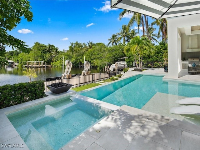 view of swimming pool featuring a water view, grilling area, and a patio area