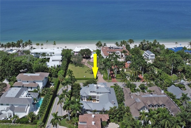 aerial view featuring a water view and a view of the beach