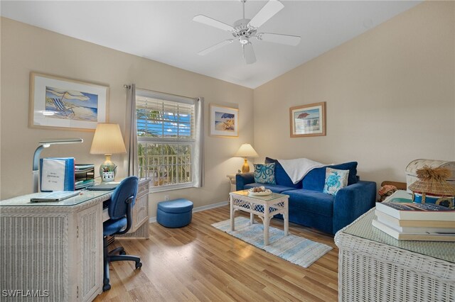 interior space with lofted ceiling, ceiling fan, and light hardwood / wood-style flooring