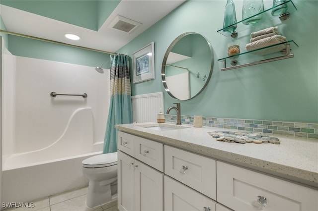 full bathroom with tile patterned flooring, vanity, toilet, and shower / bathtub combination with curtain