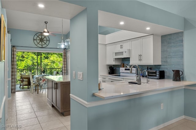 kitchen with stainless steel range with electric cooktop, white cabinetry, light tile patterned floors, kitchen peninsula, and backsplash