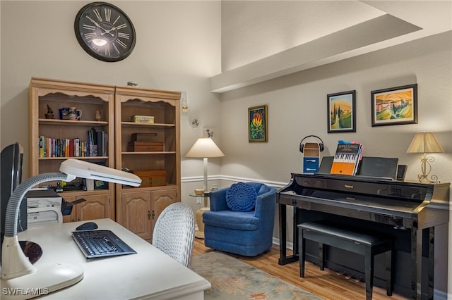 office area with light hardwood / wood-style floors