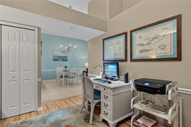 office area with a chandelier and light hardwood / wood-style floors