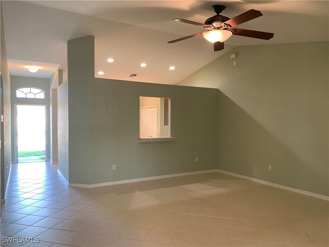 additional living space featuring lofted ceiling, light tile patterned floors, and ceiling fan