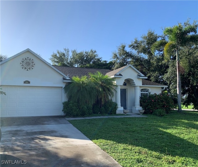 ranch-style home with a garage and a front lawn