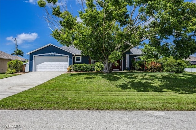 view of front facade with a garage and a front yard