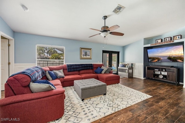 living room with plenty of natural light, ceiling fan, dark hardwood / wood-style floors, and french doors