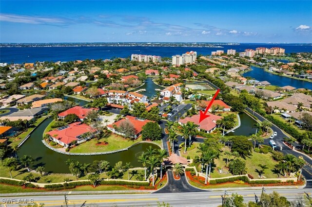 birds eye view of property featuring a water view