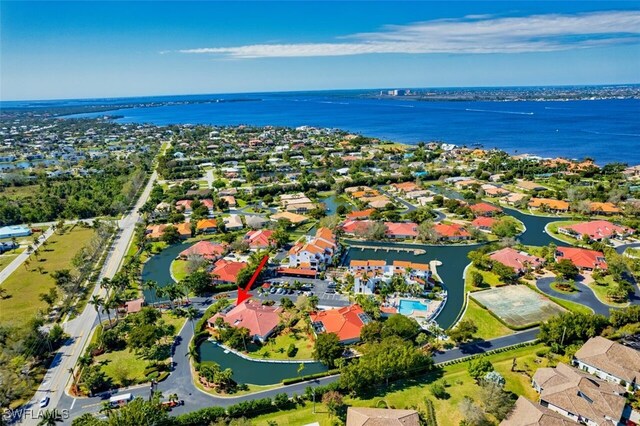 birds eye view of property featuring a water view