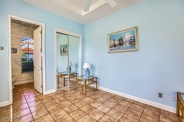 sitting room featuring ceiling fan and light tile patterned floors