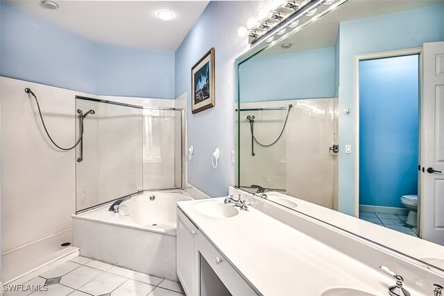 full bathroom featuring tile patterned flooring, vanity, toilet, and independent shower and bath