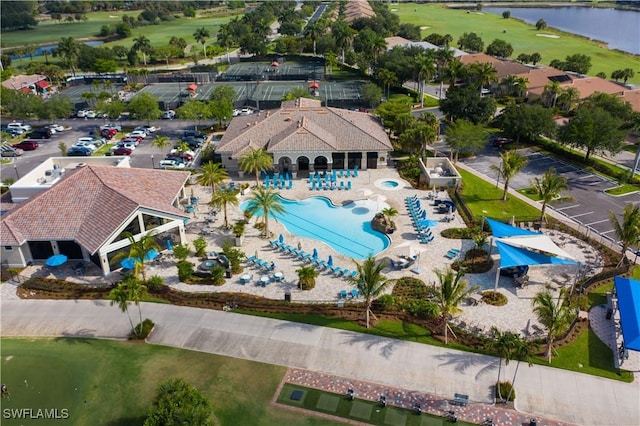 bird's eye view featuring a water view and golf course view