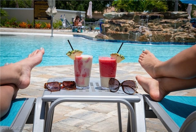 view of swimming pool with a patio