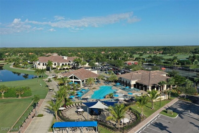 birds eye view of property with a water view