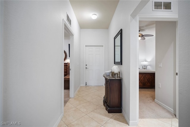 hallway with light tile patterned floors