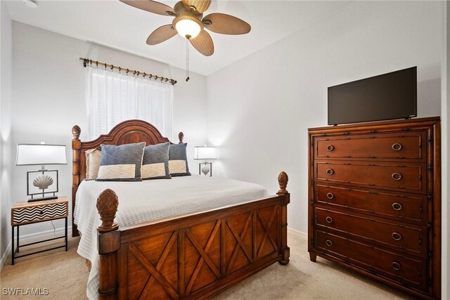 bedroom with light colored carpet and ceiling fan