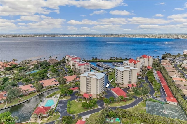 birds eye view of property with a water view