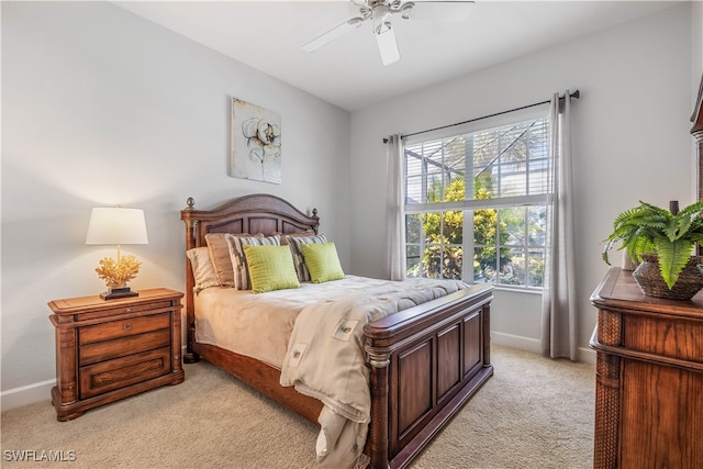 carpeted bedroom with multiple windows and ceiling fan